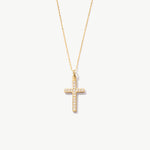 Yellow gold cross necklace with diamonds on a white background