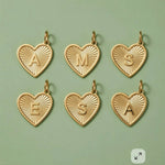 Custom initial heart charms in 14K solid gold, personalized jewelry collection.