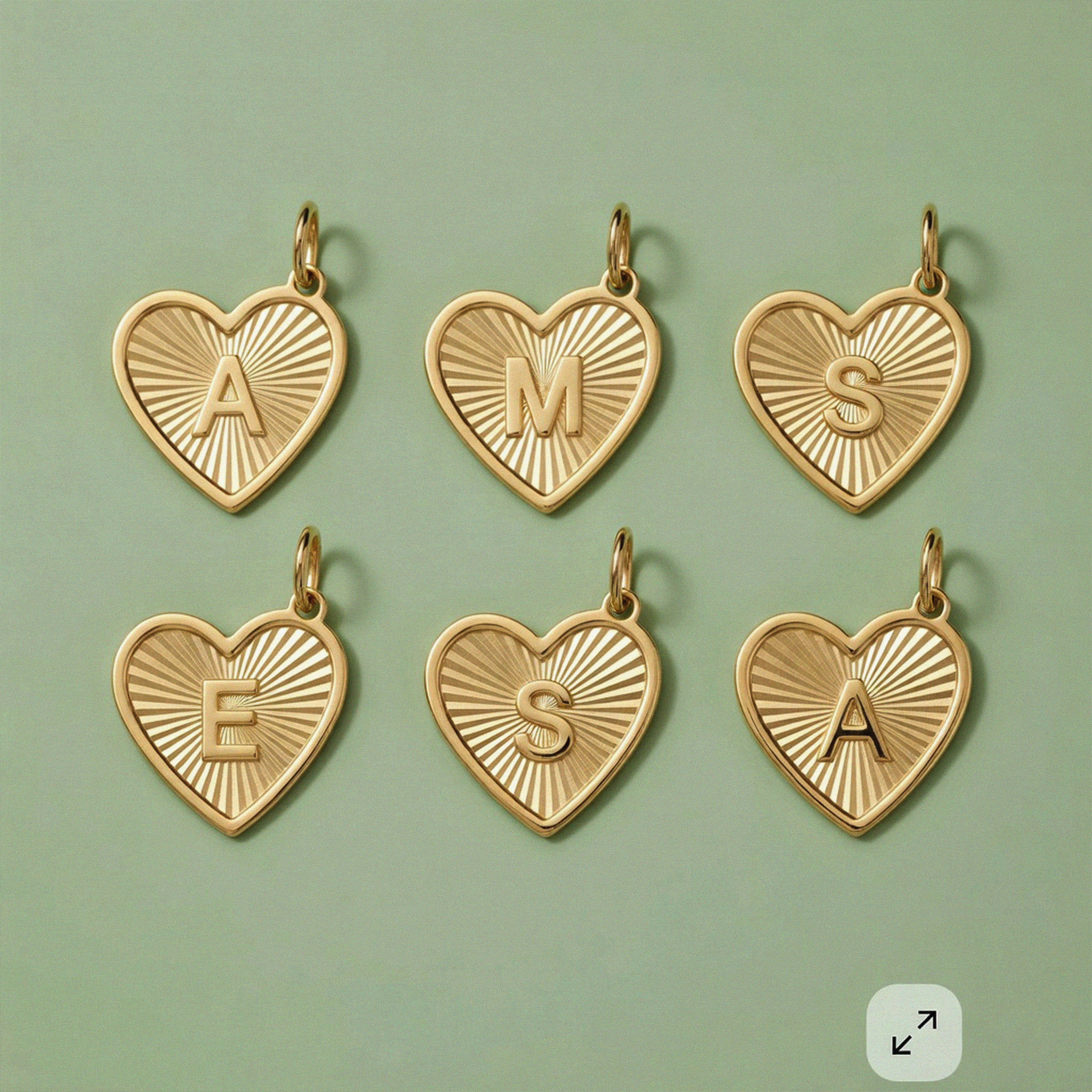 Custom initial heart charms in 14K solid gold, personalized jewelry collection.