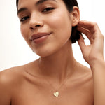 Meaningful personalized jewelry gift for her, 14K solid gold heart necklace on model.