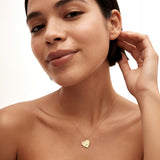 Meaningful personalized jewelry gift for her, 14K solid gold heart necklace on model.