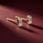 Luxury Baguette Diamond Earrings On Burgundy Background