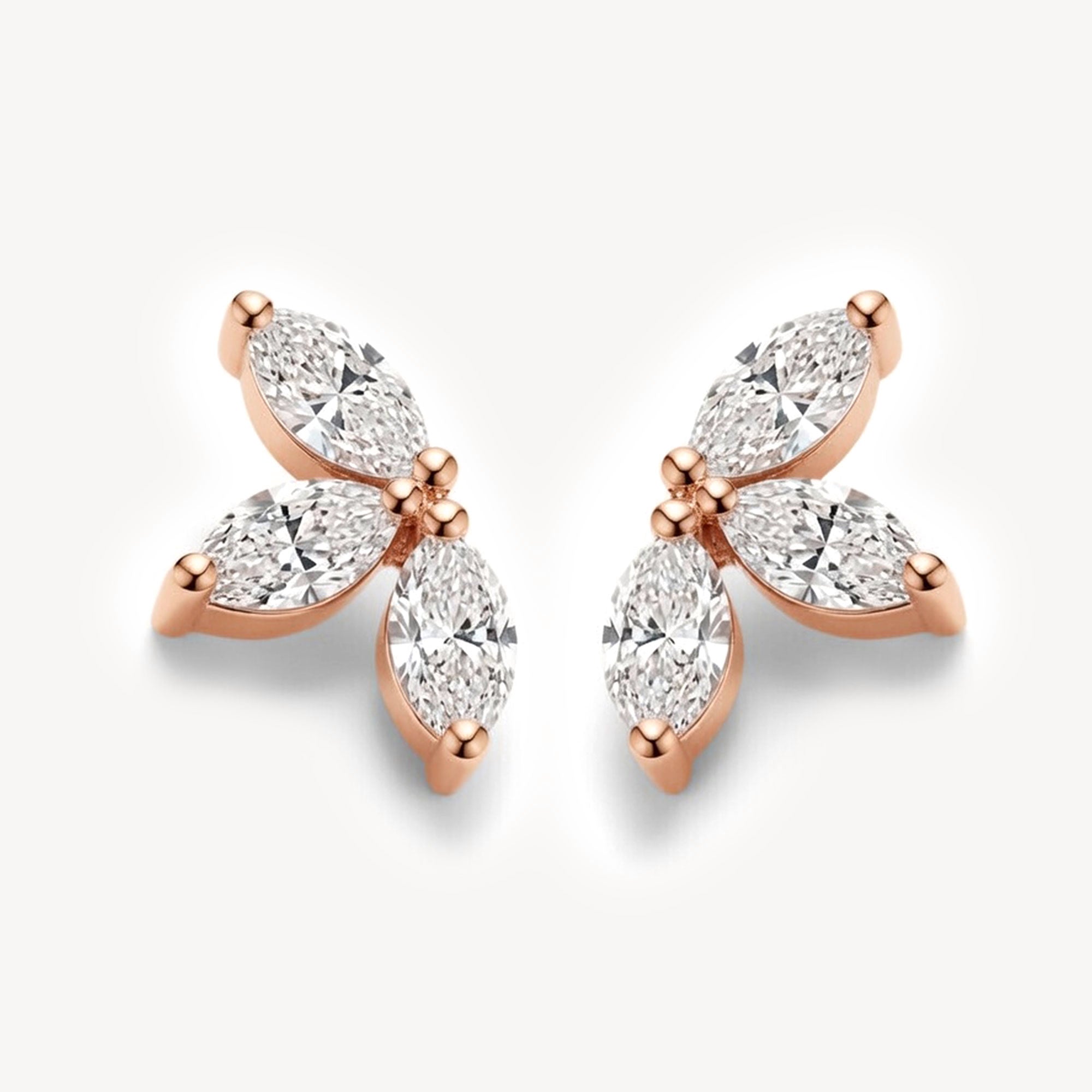 Rose gold version of lab grown diamond flower stud earrings with marquise-cut diamonds arranged in a lotus-inspired silhouette.