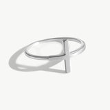 14K solid white gold cross ring photographed on a white background with realistic reflections and shadowing, featuring a minimalist sideways cross design and thin polished band suitable for stacking.