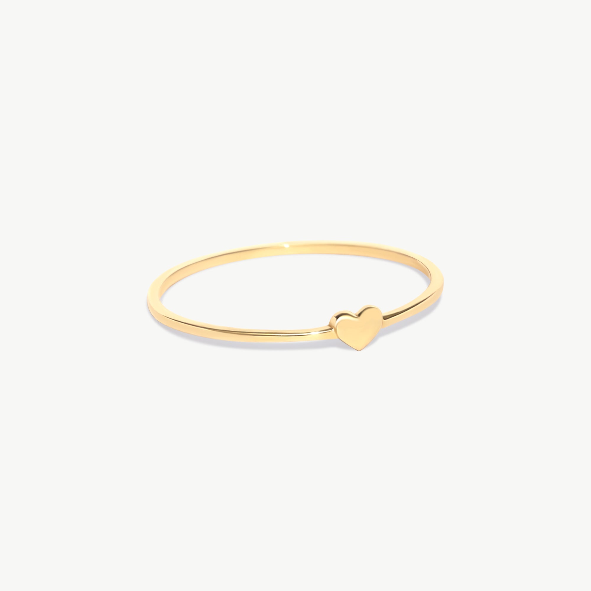 14K Solid Gold Tiny Heart Ring In Yellow Gold On White Background