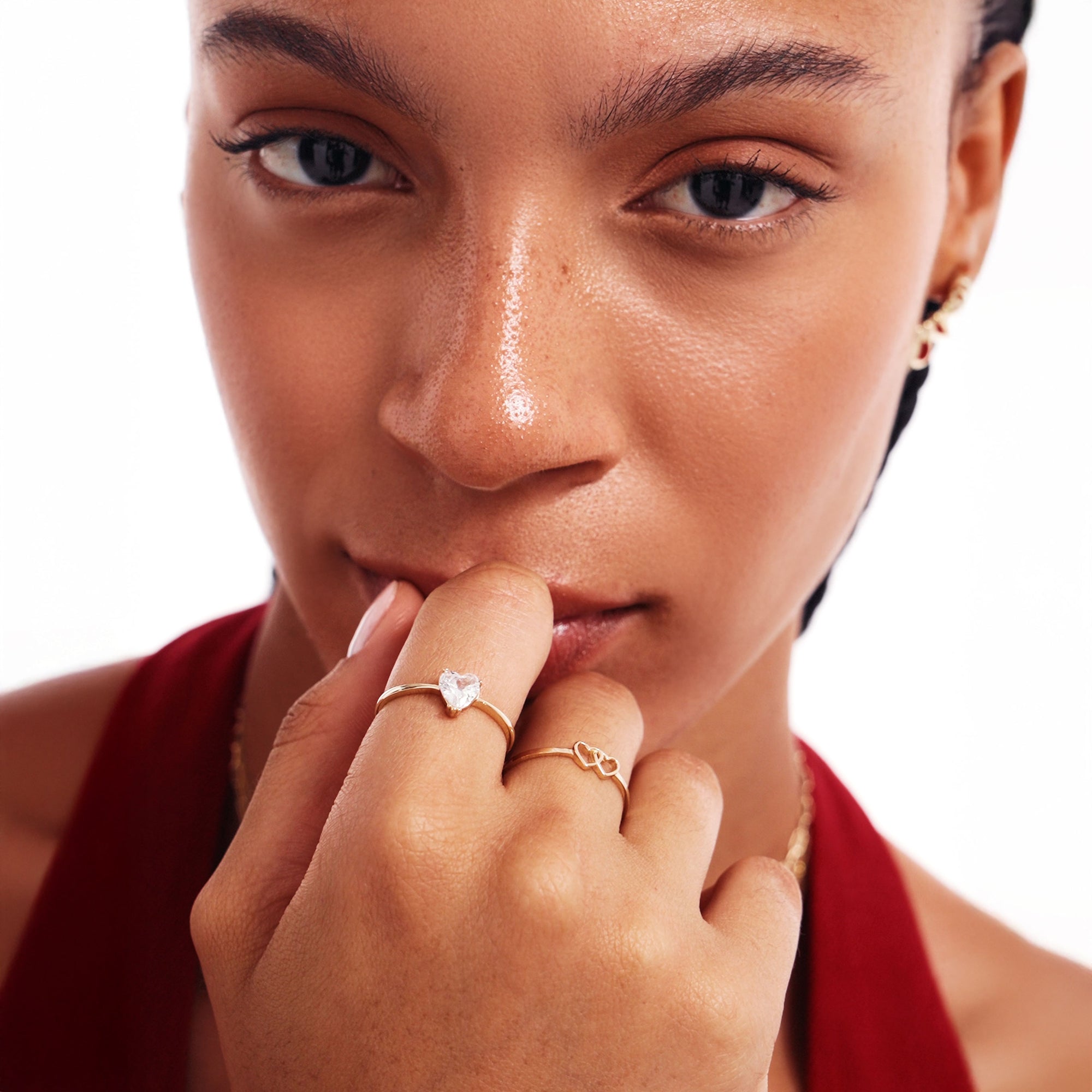 Close Up Of Woman Wearing Minimalist Double Heart Gold Ring