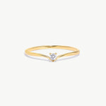 Minimalist 14K solid gold wishbone ring featuring a natural round brilliant diamond in a delicate solitaire setting on a thin V shaped polished gold band photographed on a white background.