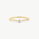 Minimalist 14K solid gold wishbone ring featuring a natural round brilliant diamond in a delicate solitaire setting on a thin V shaped polished gold band photographed on a white background.