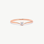 Fine jewelry product image of a rose gold wishbone ring featuring a natural round diamond solitaire center stone and delicate V shaped band design.