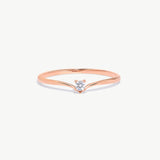 Fine jewelry product image of a rose gold wishbone ring featuring a natural round diamond solitaire center stone and delicate V shaped band design.
