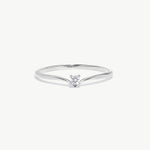 White gold wishbone solitaire ring featuring a natural round brilliant diamond in a delicate V shaped polished band photographed on a white background.