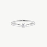 White gold wishbone solitaire ring featuring a natural round brilliant diamond in a delicate V shaped polished band photographed on a white background.