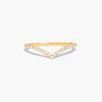 Minimalist 14K solid gold wishbone eternity ring featuring natural round brilliant diamonds pavé set along a delicate V shaped band photographed on a white background.