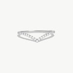 White gold wishbone eternity ring featuring pavé set natural round diamonds arranged along a refined V shaped wedding band design.