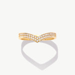 Yellow gold diamond wishbone eternity ring photographed front facing on a white background emphasizing the symmetrical V shaped pavé design.