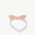 Rose gold wishbone eternity band featuring natural pavé diamonds photographed front facing with a soft heart-shaped shadow reflection.