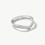White gold wishbone eternity ring featuring pavé set natural diamonds arranged along a slim V shaped wedding band silhouette.