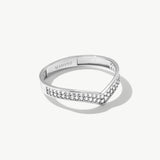 White gold wishbone eternity ring featuring pavé set natural diamonds arranged along a slim V shaped wedding band silhouette.