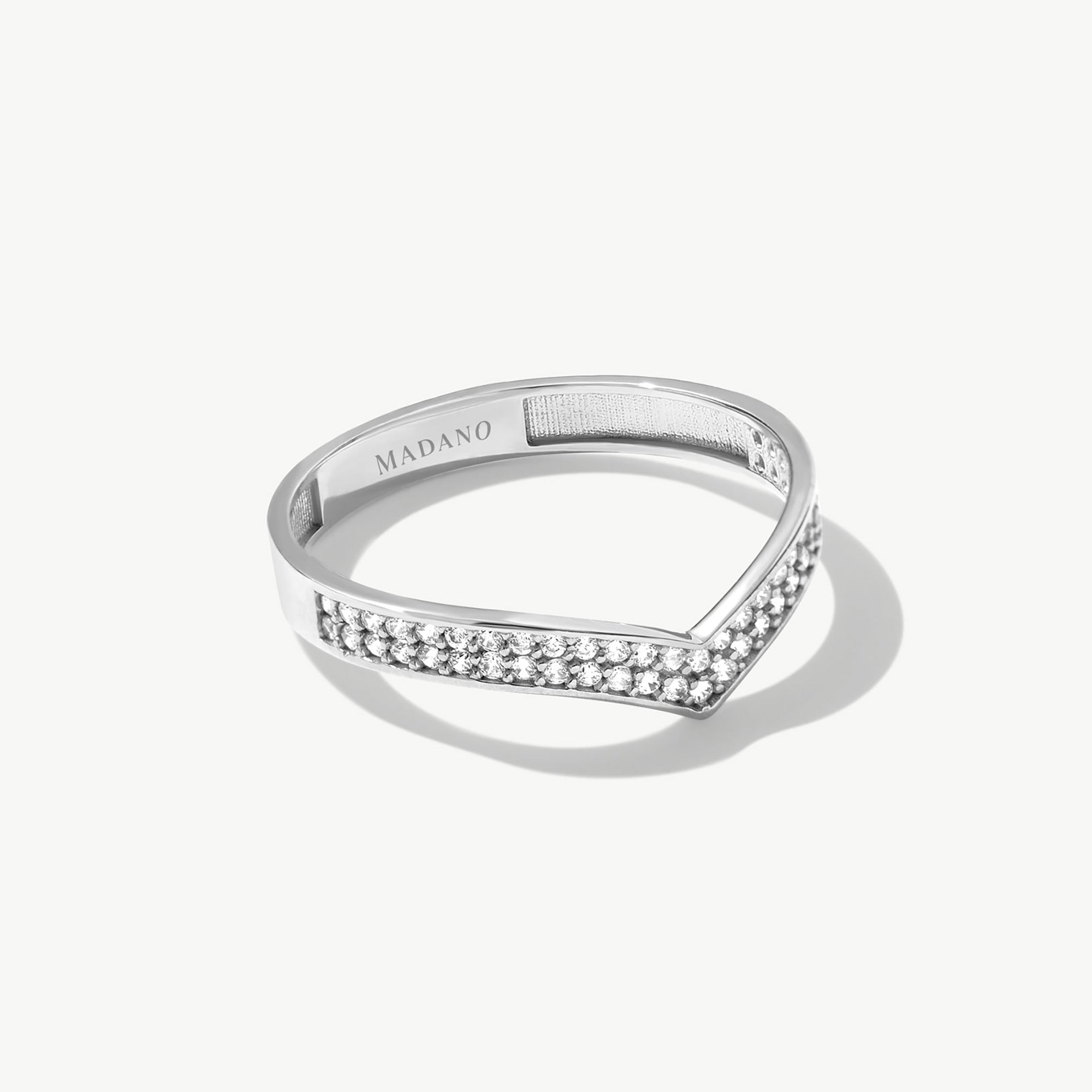 White gold wishbone eternity ring featuring pavé set natural diamonds arranged along a slim V shaped wedding band silhouette.