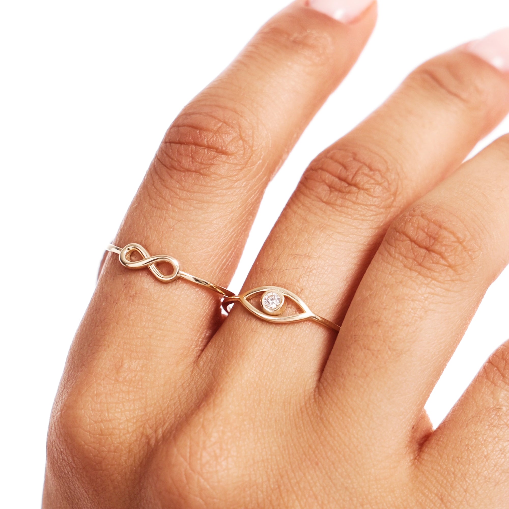 Close Up Of Woman Wearing Delicate Infinity Gold Ring