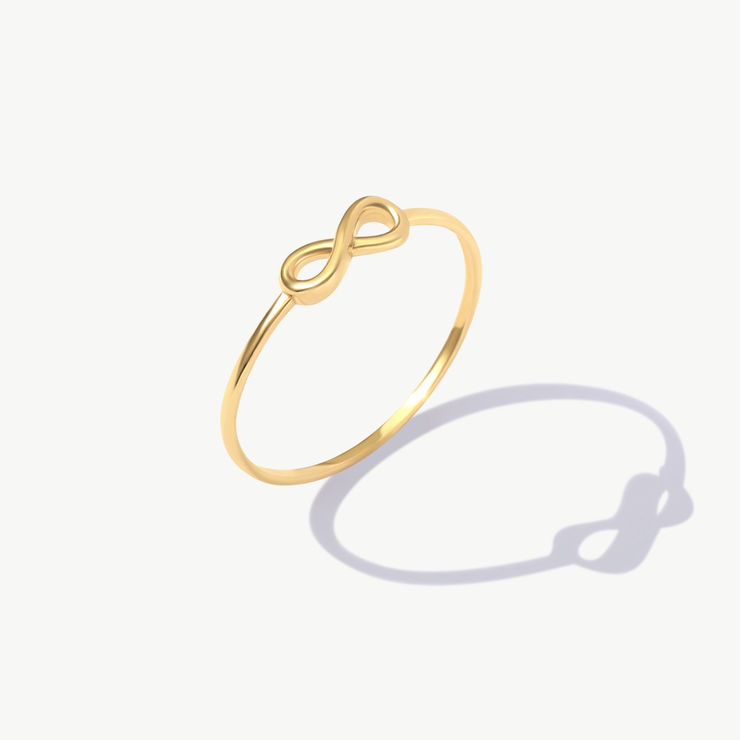 14K Solid Gold Infinity Symbol Ring On White Background
