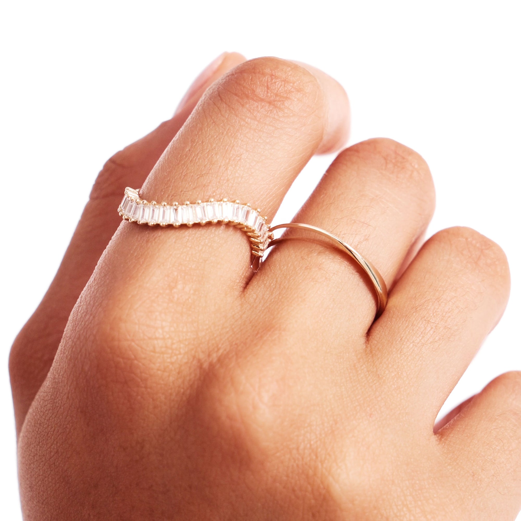 Close Up Of Minimalist Infinity Band Gold Ring On Hand
