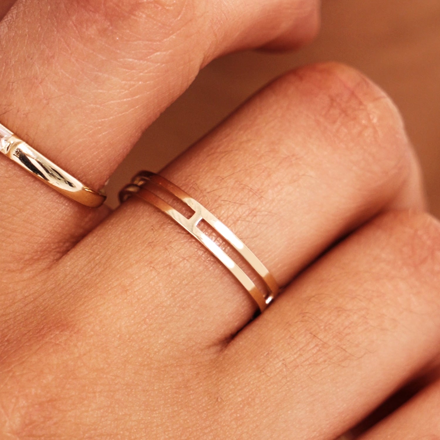 Close Up Of Minimalist Double Band Gold Ring On Hand