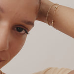 14K Real Solid Gold Bead Station Bracelet featuring dainty gold beads on a delicate gold chain, perfect as a stackable bracelet or thoughtful gift for women on occasions like Mother’s Day and Christmas.