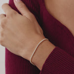 14K Real Solid Gold Cubic Zirconia Tennis Bracelet with a continuous line of cubic zirconia stones, perfect for adding sparkle to any outfit; ideal as a gift for birthdays, anniversaries, or special occasions.