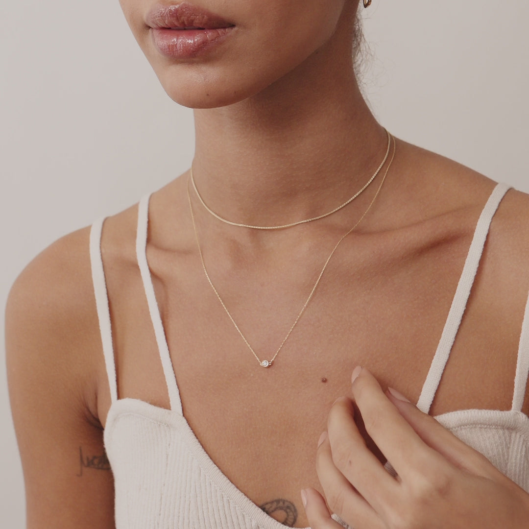14K Real Solid Gold necklace with an F color solitaire diamond in a bezel setting, showcasing minimalist elegance and perfect for gifting or daily wear. Ideal for those who value understated luxury.