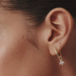 Luxurious 14K Real Solid Gold Hoop Earrings featuring sparkling Cubic Zirconia Charms, perfect for adding a sophisticated flair to any outfit.
