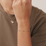 14K Real Solid Gold Emerald Bead Station Bracelet featuring vibrant green gemstones set along a dainty gold chain, perfect as a birthstone bracelet or gift for Mother's Day and special occasions.