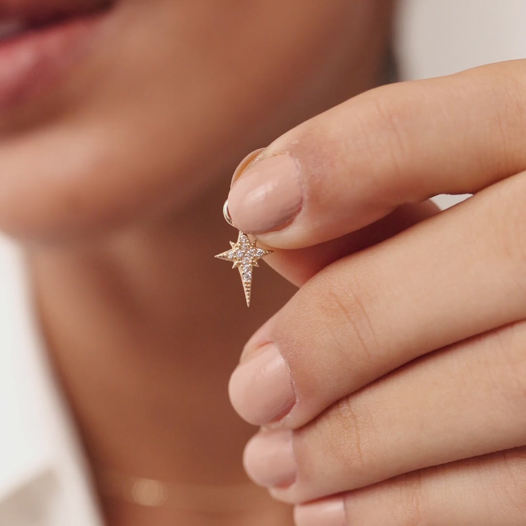 Elegant 14K Real Solid Gold North Star Earrings adorned with sparkling Cubic Zirconia Charms, perfect for adding a celestial touch to any ensemble.