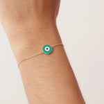 14K Real Solid Gold Bracelet with a turquoise enamel evil eye charm, representing protection and good luck, featuring an adjustable gold chain.