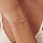 14K Real Solid Gold F Color Diamond Solitaire Beaded Bracelet with a bezel-set design, perfect for women, shown with an elegant chain and secure spring ring clasp.